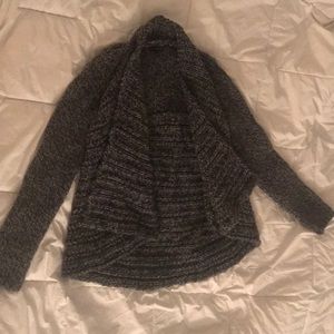 Grey knitted sweater.